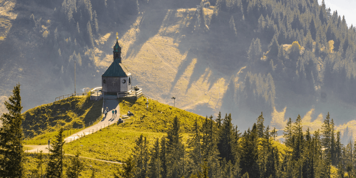 Beautiful mountain range with a church on a hill